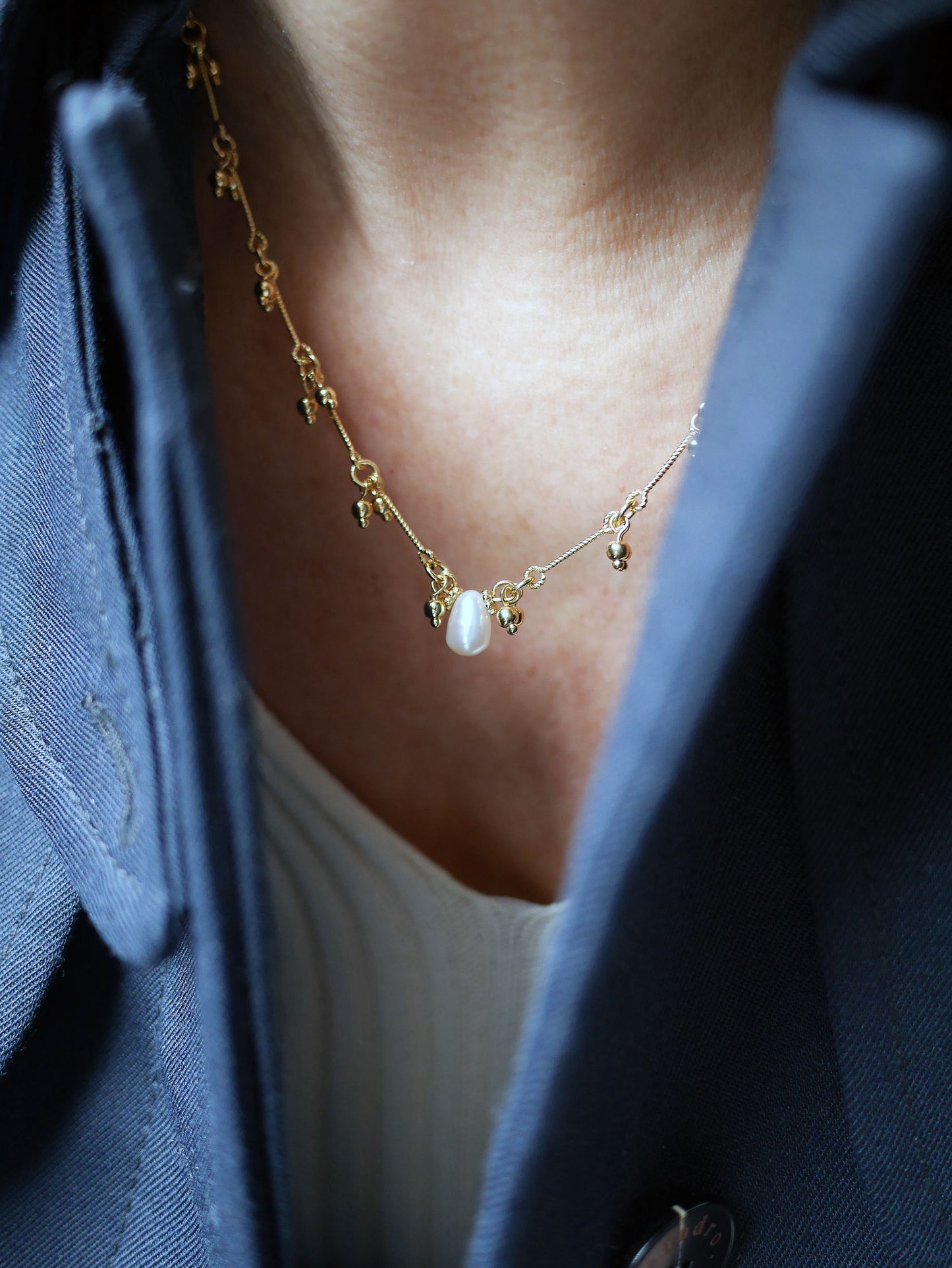 Collier clochette perle