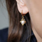 Petites boucles oreilles clochette perle