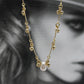 Collier clochette perle