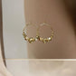 Boucles oreilles mini créole fil et perles irrégulières dorées - Nadia